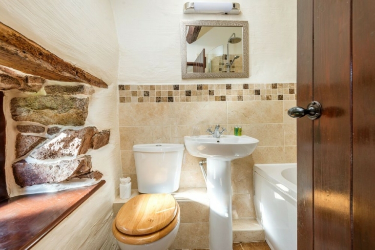 Hardknott bathroom with 500 year old exposed pink Eskdale granite