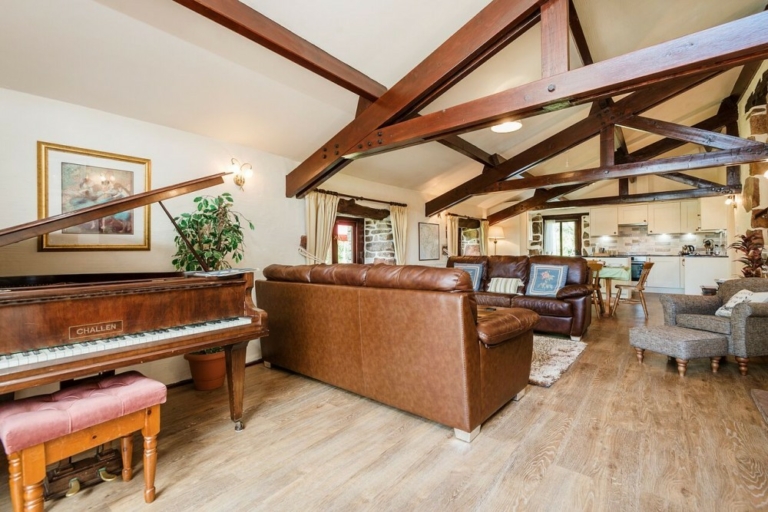 Wastwater's huge living room with baby grand piano