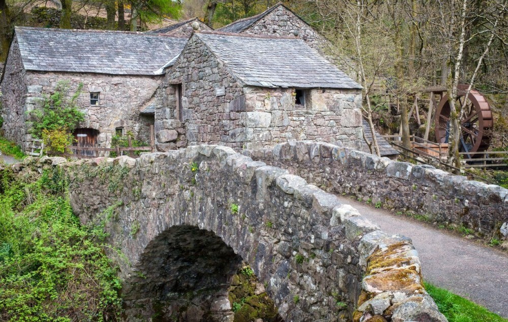 Whillan Beck Cottage bedroom view of 17th century packhorse bridge